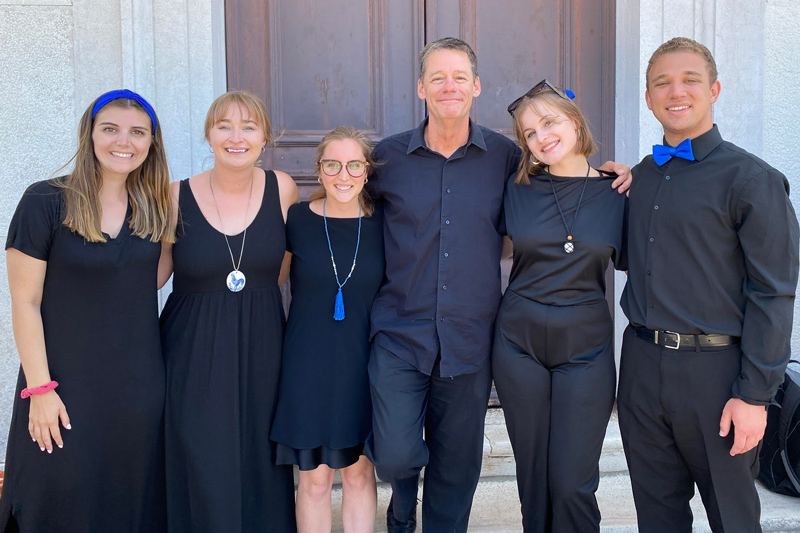 Delaware Choral Scholars singers stand with artistic director and founder, Paul Head.