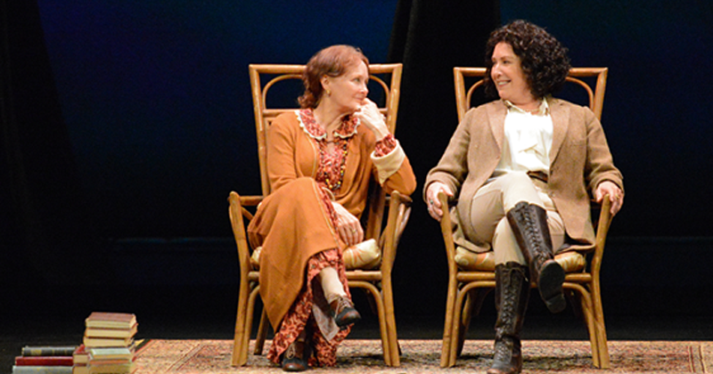 REP actors sitting in chairs on stage