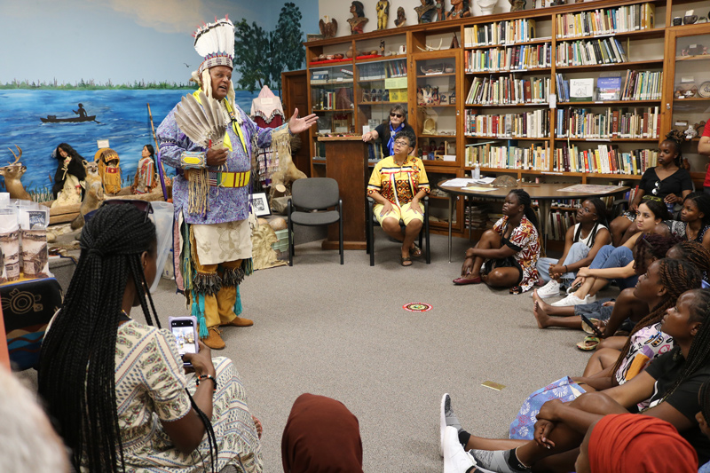 The SUSI program students visited the Nanticoke Indian Museum in Millsboro, Delaware as part of their leadership program. Herman Jackson, in traditional dress, explains the Nanticoke culture to the students. 