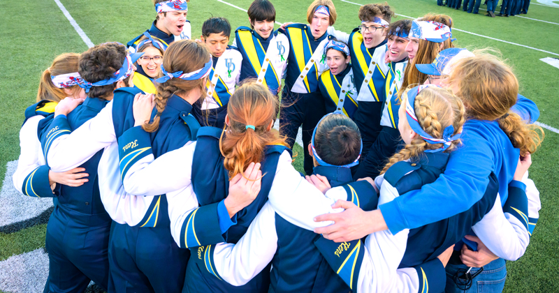 band in a huddle