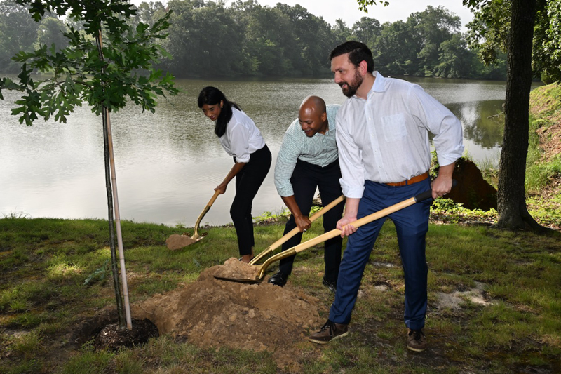 Secretary Josh Kurtz is joined by Governor Wes Moore and Lieutenant Governor Aruna Miller to plant a tree at the Wye River Natural Resources Management Area in July 2023.