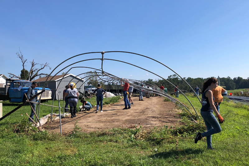 Volunteers came together in droves to help Len Grasso rebuild his farm after a devastating storm.