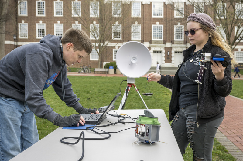 University of Delaware physics students Jarrod Bieber and Millie Dill worked together on The Green in March to test the Eclipse Chasers’ tracking system and be sure essential connections were happening between the team’s computer, the satellite network that relays messages and the balloon’s electronics. Those connections make it possible for the team to track the research balloon’s progress and livestream video from the balloon to NASA during the eclipse. The tracking devices also help the team locate and retrieve their balloon and instruments after it all descends back to earth.