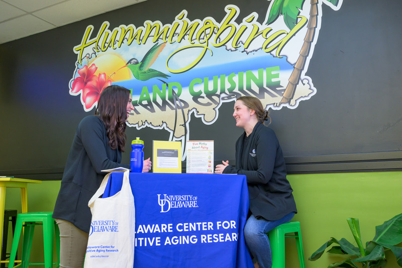 Alyssa Lanzi, assistant professor of communication sciences and disorders (CSCD), and CSCD doctoral student Anna Saylor have partnered with local businesses, including inside Hummingbird Island Cuisine in downtown Wilmington, to recruit study participants and build trust. Alyssa Lanzi, assistant professor of communication sciences and disorders (CSCD), and CSCD doctoral student Anna Saylor have partnered with local businesses, including inside Hummingbird Island Cuisine in downtown Wilmington, to recruit study participants and build trust.