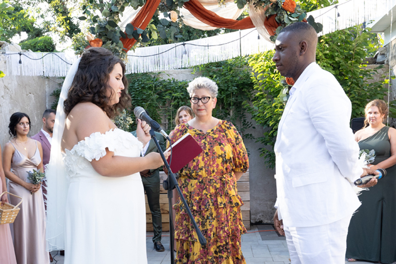 Operations management instructor Susan Murphy officiates the wedding of Megan and Joshua Clarke, Double Dels who took Murphy’s class together as undergraduates at UD.