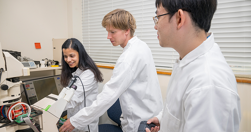 Mechanical Engineering postdoc Sudipta Mallick works on microbot research in Assistant Professor Sambeeta Das’ lab with doctoral candidates Yanda Yang (right) and fellow postdoc David Rivas (center).