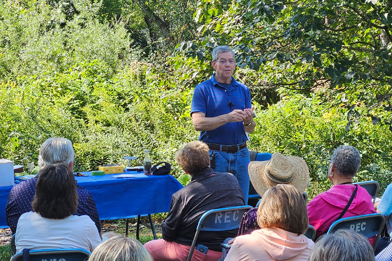 Robert Lyons, UD emeritus professor, hosts the trainees at the UD Botanic Gardens.