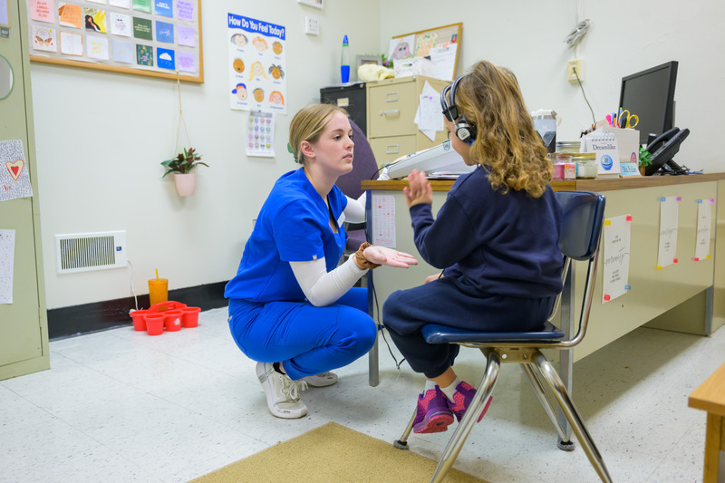 Lexie Maxwell, a graduate student in UD’s Speech-Language Pathology program, makes hearing screenings fun for kids. She tells them to give her a high-five when they hear a beep. Lexie Maxwell, a graduate student in UD’s Speech-Language Pathology program, makes hearing screenings fun for kids. She tells them to give her a high-five when they hear a beep.