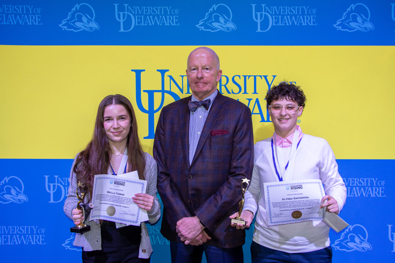 CEHD Dean Gary T. Henry (center) poses for a picture with competition winners Bella Tabor (left) and Alyssa Saporsa (right) after presenting their awards. 