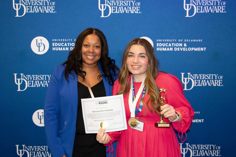 Jamie Bailey, CEHD recruiter for teacher preparation programs, poses for a photo with College of Arts and Sciences student Kaylea Patterson after she wins the first place gold award in the Public Speaking collegiate competition.