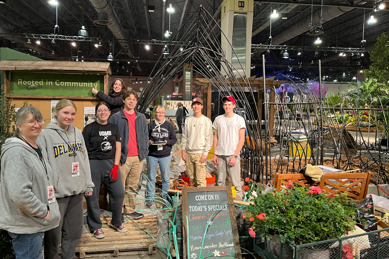 UD Flower Show Club co-advisor Karen Gartley (left) and the UD students quickly got to work planting and organizing the exhibit the week before the show.