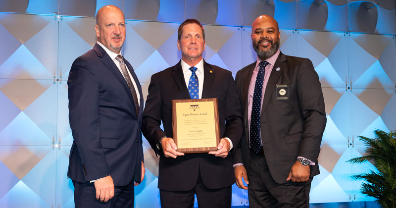UD Police Chief Patrick Ogden is presented CALEA's Egon Bittner Award