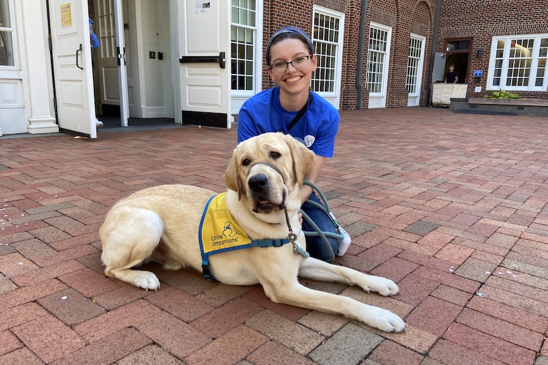 Baloo, an 11-month-old labrador retriever, is being raised by resident assistant Emma Domenick through Collar Scholars, one of three UD student organizations that raises puppies to eventually help people in need. On move-in day, Baloo helped out families by opening the doors using the accessibility buttons — a skill he’ll be able to put to use in the future as a service dog. Baloo, an 11-month-old labrador retriever, is being raised by resident assistant Emma Domenick through Collar Scholars, one of three UD student organizations that raises puppies to eventually help people in need. On move-in day, Baloo helped out families by opening the doors using the accessibility buttons — a skill he’ll be able to put to use in the future as a service dog.