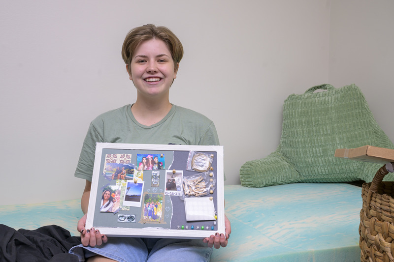 Thea Paxton, a music education major from Dover, Delaware, brought her bedding, photos, books and a lamp from home to give the new space a familiar feel. Thea Paxton, a music education major from Dover, Delaware, brought her bedding, photos, books and a lamp from home to give the new space a familiar feel.