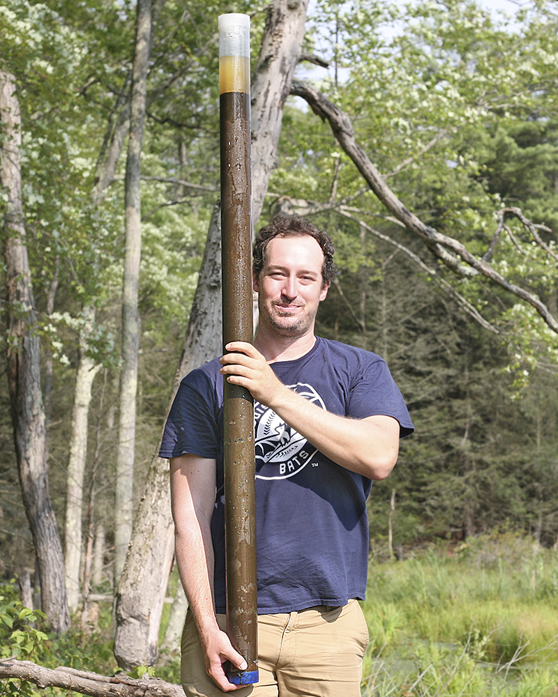 Ray holds a sediment core collected from a pond in upstate New York. Ray holds a sediment core collected from a pond in upstate New York.