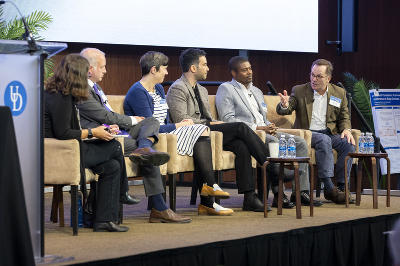Tom Powers, associate professor of philosophy and director of the University of Delaware’s Center for Science, Ethics and Public Policy (far right), gestures during a panel discussion that was part of a symposium on artificial intelligence and ethics, sponsored by UD’s Data Science Institute. “I like to think ethics occupies the space between public opinion and the law,” Powers said. With him in this photo (left to right) are moderator Kathy McCoy, professor of computer and information sciences at UD; keynote speaker Katie Shilton of the University of Maryland; Matthew Holtman, executive director at JPMorgan Chase & Co.; Nii Adjetey Tawiah, assistant professor of sociology at Delaware State University; and Jay Yonamine, advisor to EdgeRunner AI, which develops device-based generative AI assistants.