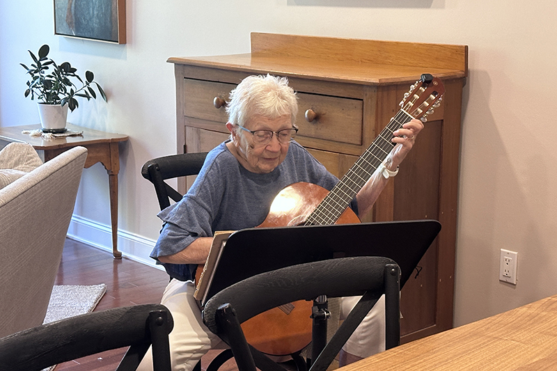 Peggy J. Ostrom Schultz proves it is never too late to bring music into your life. She practices guitar several hours a week at her home in Newark. 
