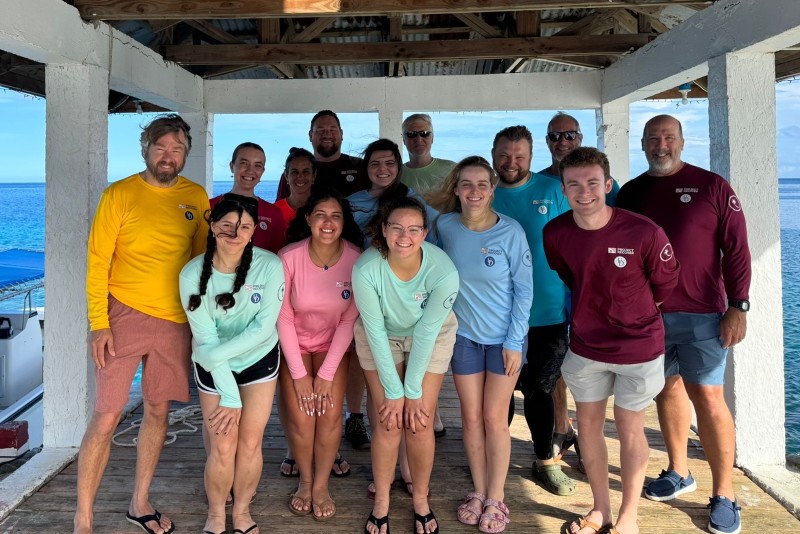 The group on the dock at Chuuk Lagoon in Micronesia. The team found two downed American planes during the trip, which is rare. The group on the dock at Chuuk Lagoon in Micronesia. The team found two downed American planes during the trip, which is rare.