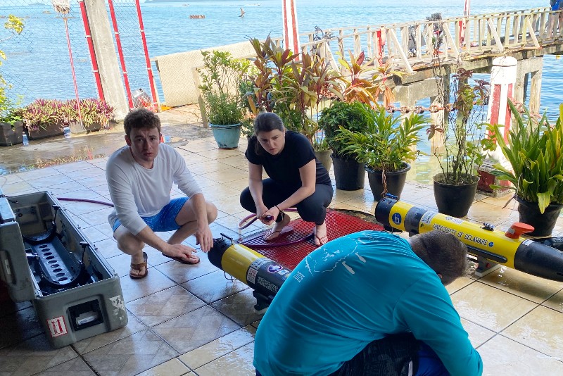 Stephen Maister (left) was one of eight UD students who spent last month looking for downed planes and MIAs from World War II in Micronesia as interns with Project Recover. He and fellow UD student Lauren Koch help clean the autonomous underwater vehicles that map the seafloor. Stephen Maister (left) was one of eight UD students who spent last month looking for downed planes and MIAs from World War II in Micronesia as interns with Project Recover. He and fellow UD student Lauren Koch help clean the autonomous underwater vehicles that map the seafloor.