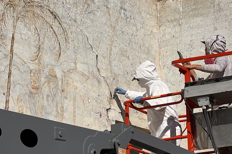 Margalit Schindler was helping the Pasadena Jewish Temple and Center decide how to address a mural discovered on the last wall standing on its site. Here, Schindler takes a sample of the mural for further testing and analysis. The wall has since been demolished, but pieces of the mural were salvaged. Margalit Schindler was helping the Pasadena Jewish Temple and Center decide how to address a mural discovered on the last wall standing on its site. Here, Schindler takes a sample of the mural for further testing and analysis. The wall has since been demolished, but pieces of the mural were salvaged.