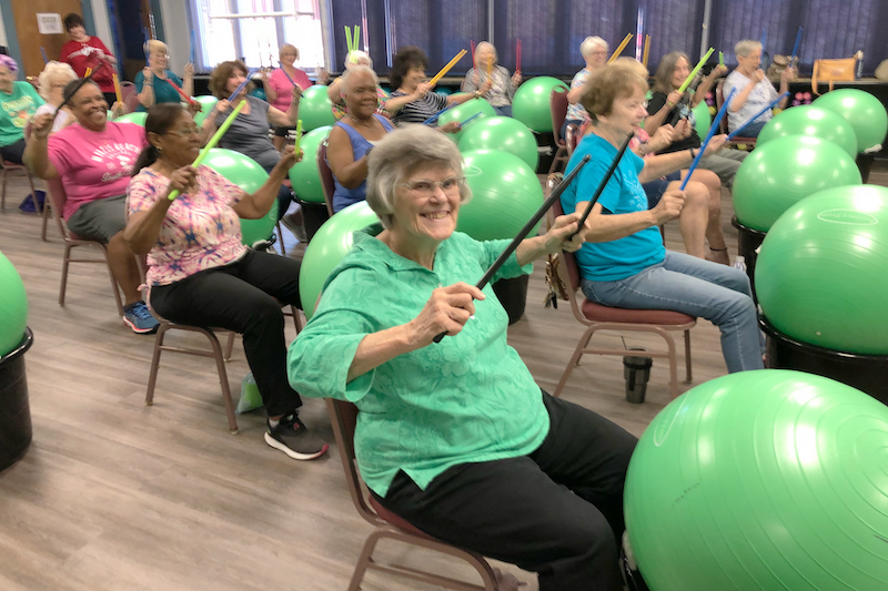 Seniors at the Weston Senior Center get a round of cardio in a drumming class. Seniors at the Weston Senior Center get a round of cardio in a drumming class.