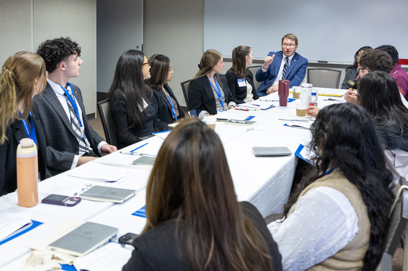 Shaffer guides a group of students during a breakout room session.