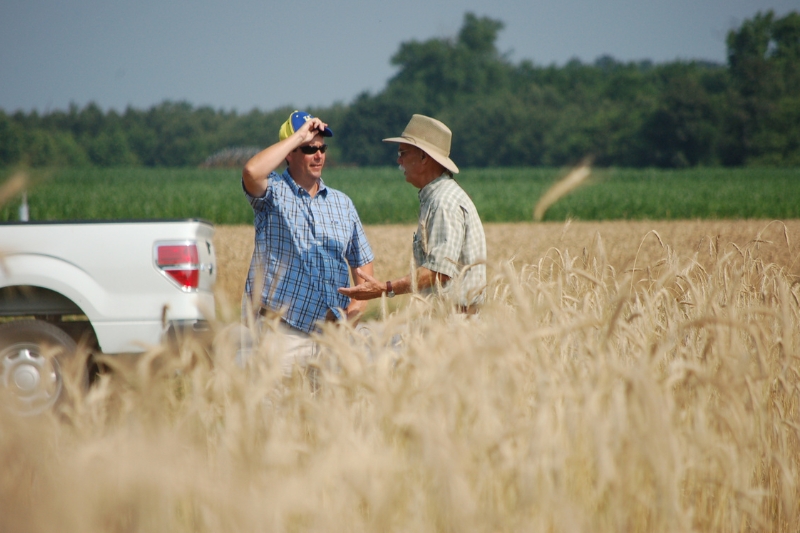 Cory Whaley talks to a crop advisor during a weed science field day at UD’s Carvel Research and Education Center in Georgetown, Delaware. One-on-one discussions between stakeholders and agents are a valued tradition.
