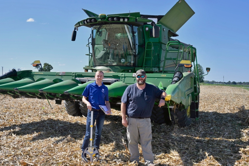 UD’s Drew Harris visits Kent County farmer Jonathan Snow. Extension agents like Harris qualify as supervisors for contestants entering yield information for the National Corn Growers Association’s annual corn yield competition.