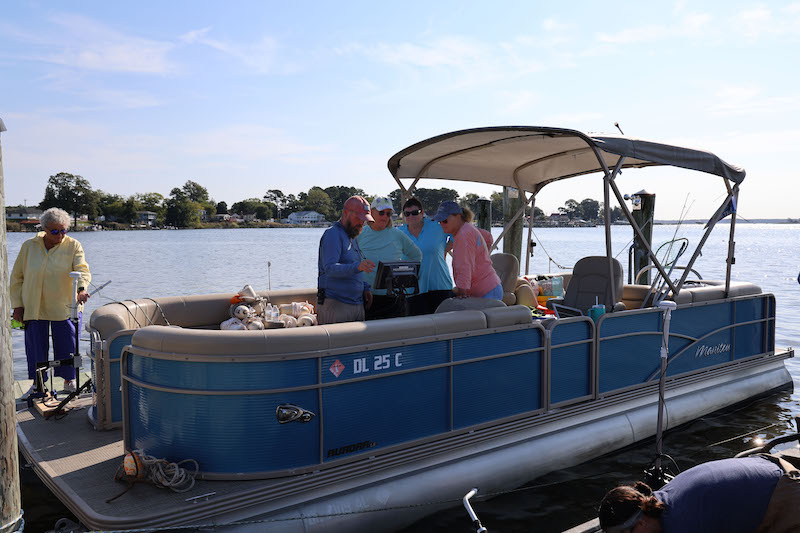 Gail Kelso, Mary Ann Varner, Mickey Nagle and Kathy Ellis volunteered with UD’s Delaware Sea Grant to help find lost or abandoned crab pots in the Indian River. As part of the day, the friends learned how to locate crab pots using sonar with training provided by UD experts. 