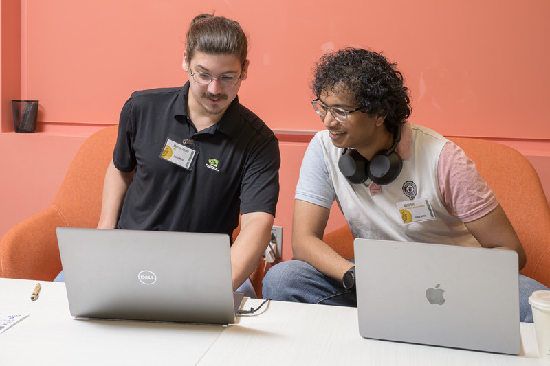 Among the hackathon mentors were Mauricio Ferrato (left), who received his Ph.D. in computer science from UD in 2023 and is now a senior solutions architect at NVIDIA, and Nikhil Rao, who received his master’s in cybersecurity at UD and is now a software engineer working on space weather models at the NSF National Center for Atmospheric Research. He is now in the Ph.D. program in computer science at UD. 