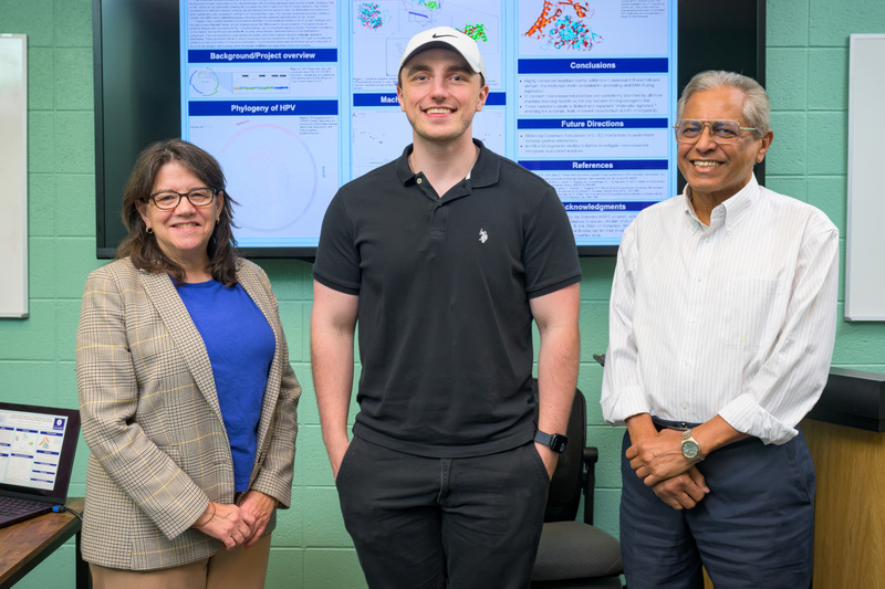 Left to right, Esther Biswas-Fiss, professor and chair of medical and molecular sciences, senior honors medical diagnostics major Sean Fletcher, and Sam Biswas, professor of medical and molecular sciences, worked together to uncover specific mutations that may alter protein function and significantly increase cancer risk, paving the way for improved approaches to diagnosing and treating HPV-related cancers. Left to right, Esther Biswas-Fiss, professor and chair of medical and molecular sciences, senior honors medical diagnostics major Sean Fletcher, and Sam Biswas, professor of medical and molecular sciences, worked together to uncover specific mutations that may alter protein function and significantly increase cancer risk, paving the way for improved approaches to diagnosing and treating HPV-related cancers.