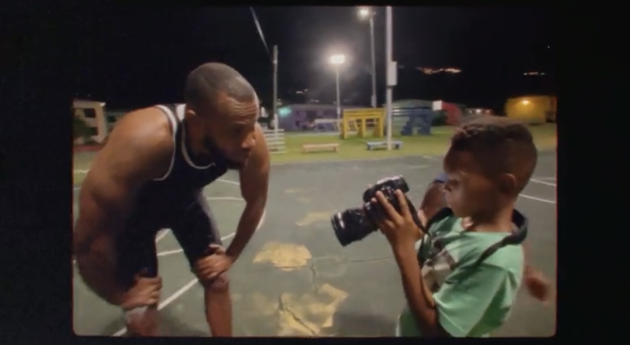 Peter Bailey and boy with camera