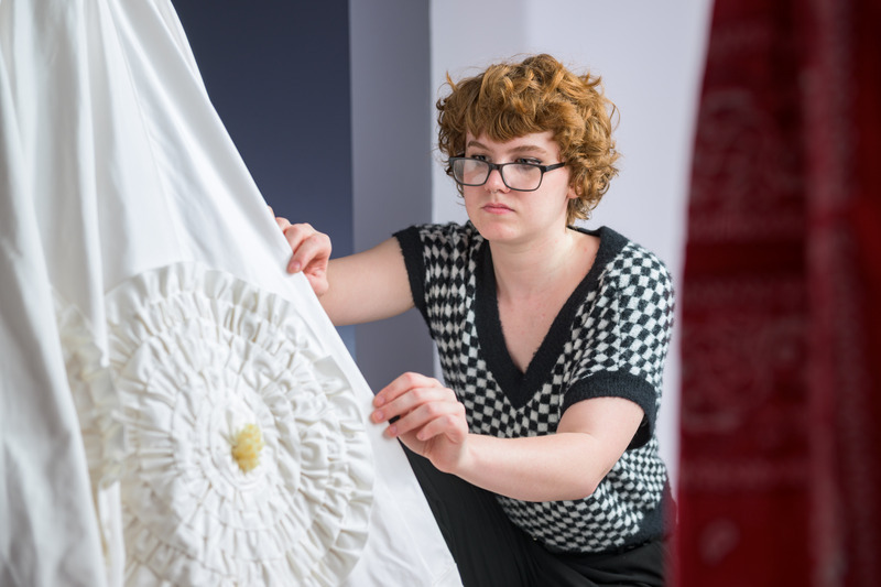 Culley spent the summer after his first year at UD helping Katya Roelse, instructor in fashion and apparel studies, recreate the iconic wedding dress that designer Ann Lowe made for Jackie Kennedy in 1953, including the dress’s signature rosettes.   Culley spent the summer after his first year at UD helping Katya Roelse, instructor in fashion and apparel studies, recreate the iconic wedding dress that designer Ann Lowe made for Jackie Kennedy in 1953, including the dress’s signature rosettes.