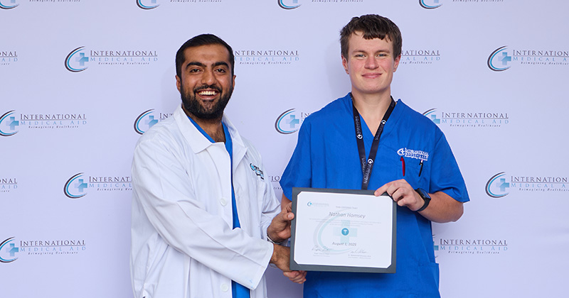 Nate Homsey (right) with Dr. Shazim Bagha, IMA Senior Physician Mentor, during the Certificate Ceremony at Coast General Teaching and Referral Hospital.