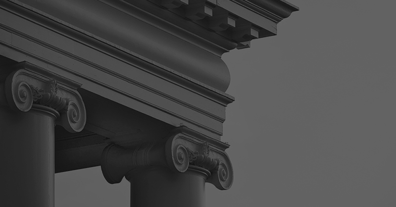 black and white photo of building pillars
