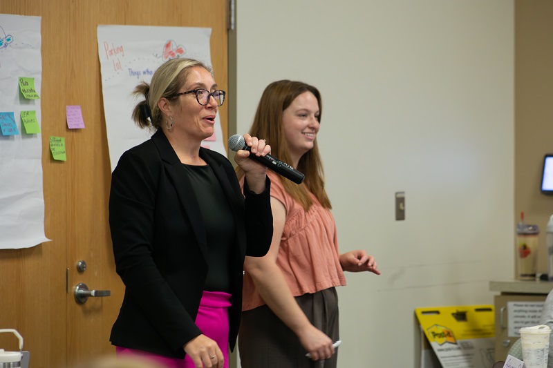 Lauren Conrad (left), education associate for visual and performing arts and gifted at the Delaware Department of Education, introduces a professional development session led by UD AAC Specialist Hannah Mennella (right) and her colleague, Angelia Wilt, instructional coach with the Multi-Tiered System of Support Technical Assistance Center.