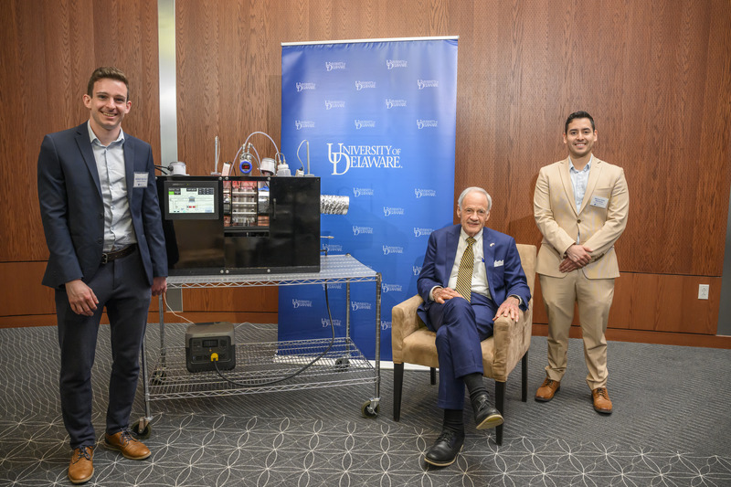 Following the event, Carper spent time speaking with attendees, including Michiel Van Eyck (left) and Marco Colin Martinez (right), doctoral students working in UD’s Center for Clean Hydrogen. The students are developing a hydrogen-powered carbon capture system with potential applications in direct air capture, air revitalization for space missions and submarines, and the production of sustainable aviation fuel.