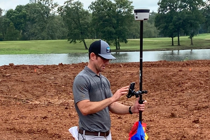 Ian Williams, UD Class of 1997 and owner of Green Irrigation Solutions (GSI), completing a sprinkler head layout in Louisiana. Williams says technological improvements allow for more responsible use of water on the golf course. 