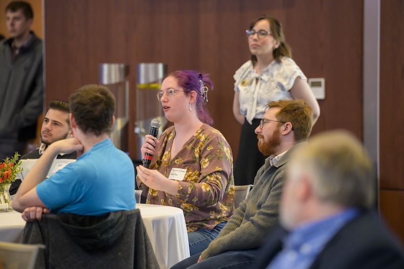 Audience members engaged with presenters during Q&A sessions at the spring 2026 Graduate College Spark! Symposium.