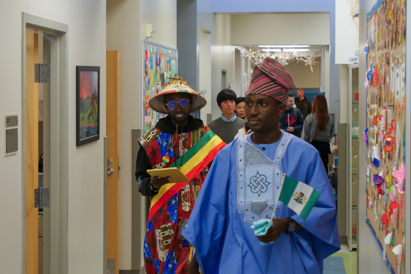 Gbenga Samuel Bamidele (right) of Nigeria and Cheikh Amadou Tidiane Niang (left) of Senegal tour The College School as part of the program.