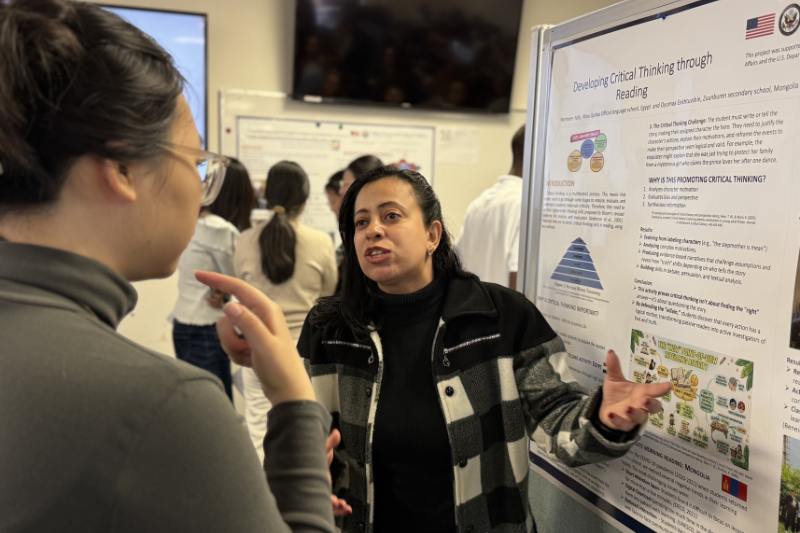 Nermeen Adly of Egypt shares her final poster presentation with ELI students, faculty and staff.