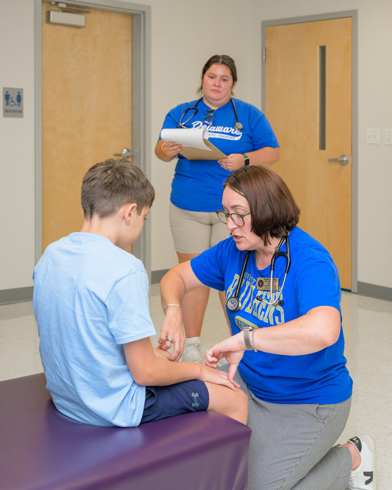 Graduate students in UD’s Athletic Training program assisted with the free sports physicals under Heather Milea’s supervision. 
