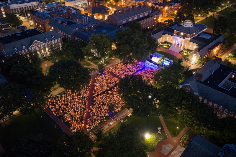 UD’s newest students gather on The Green for the University’s Twilight Induction Ceremony, a ritual that welcomes to campus all new students and marks the official start of their time at UD.