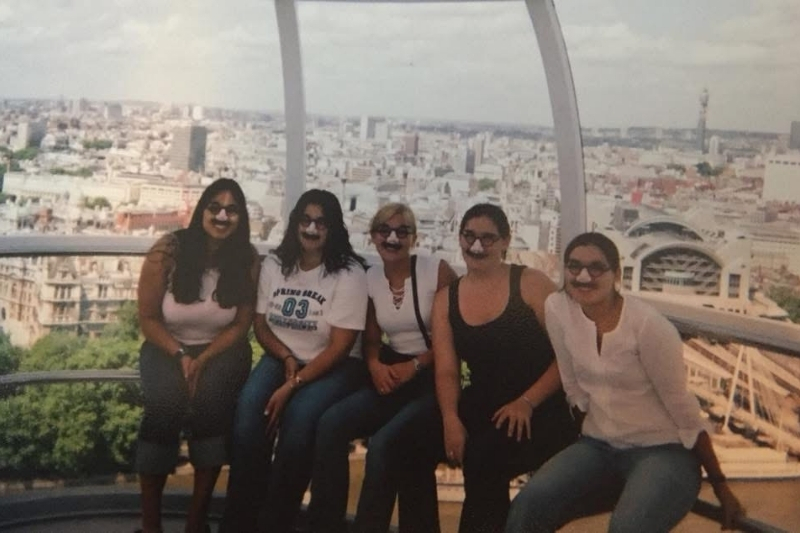 Carro, Mathews, Reith and Curry pose with fake mustaches along with fellow UD alumna Brooke Waldron at the London Eye, the world's tallest cantilevered observation wheel, along the River Thames in London.