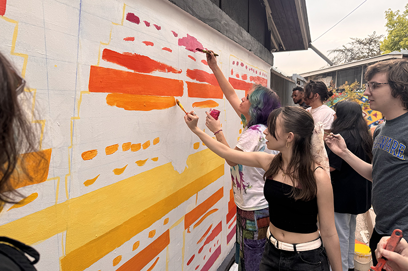 Students contributed to a mural with artist Juana Perez, who has created murals in Chile, Peru, Ecuador and Mexico reflecting each country’s visual, indigenous traditions. 