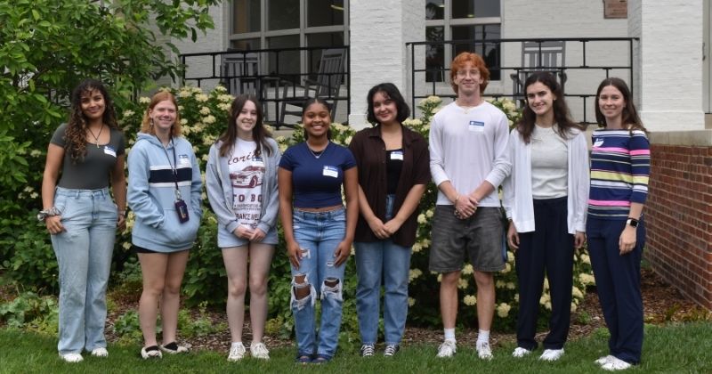 Summer 2025 Extension Scholars stand together, posing for a photo in front of Townsend Hall
