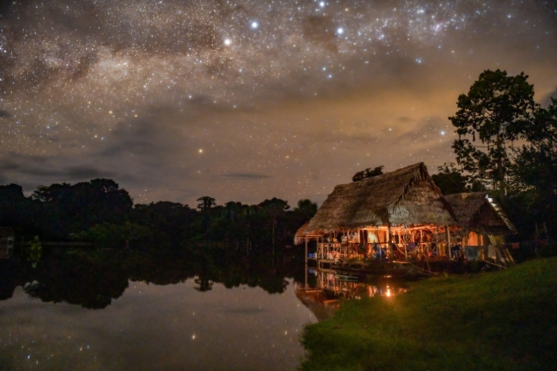 Griffiths’ house in Sucusari, constructed by the Maijuna in traditional fashion, under the Milky Way.