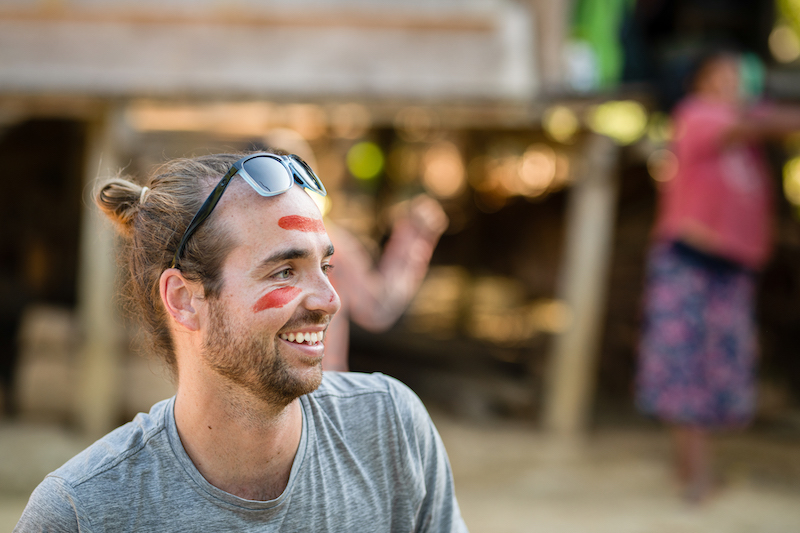 Griffiths is asked to participate in a Maijuna cultural ceremony called yuca verde after a long day in the field, which includes body painting using a plant, achiote.