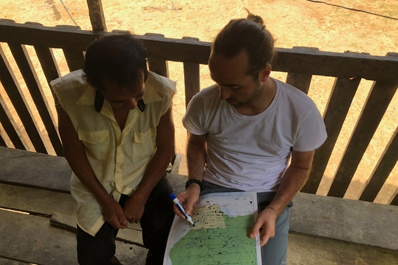 Griffiths conducts a participatory mapping interview with an elder to understand hunting territories. 