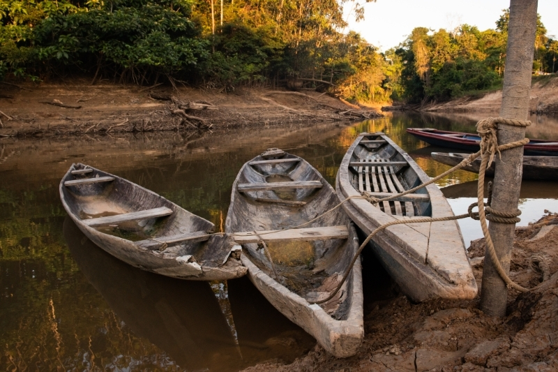 The river drops in Sucusari outside Griffiths’ house in the dry season, leaving boats and canoes with little water. 